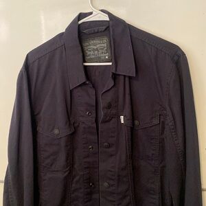 Levi’s canvas “Jean jacket” dark navy blue.